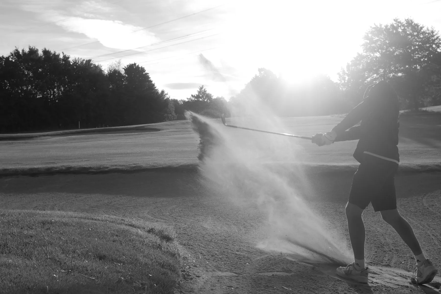 Mann spielt auf einem Feld Golf von Getyourswing